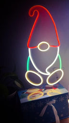 Christmas neon LED signboard displayed in cozy holiday atmosphere