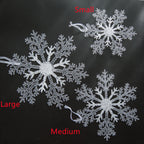 Transparent snowflake pendant displayed near window with winter light streaming through