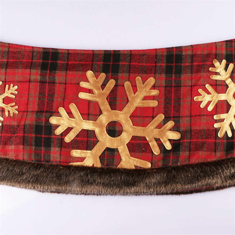 Non-woven fabric Christmas tree skirt with plaid snowflake pattern in home setting