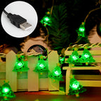 Close-up view of plastic LED Christmas lights glowing green