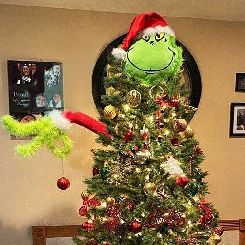 Green prosthetic leg ornament displayed on Christmas tree branch
