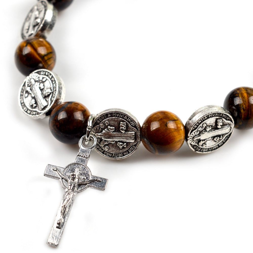 Close-up of tiger eye beads on Saint Benedict rosary bracelet showing natural stone texture and quality