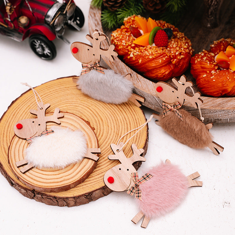 Gray wooden running elk Christmas ornament on neutral backdrop