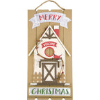 Holiday decorative wooden house ornament showcasing warm Christmas ambiance