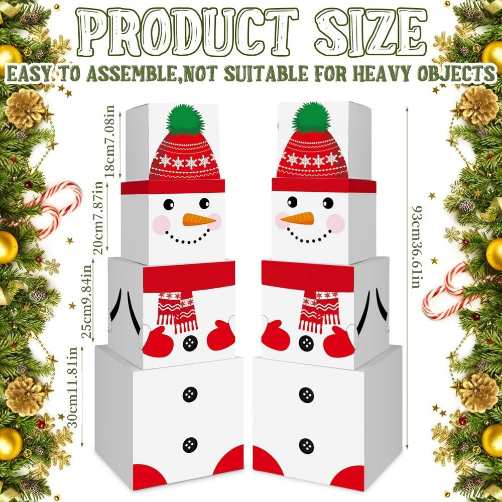 Festive snowman decoration boxes arranged as holiday table centerpiece