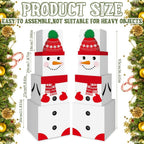 Festive snowman decoration boxes arranged as holiday table centerpiece