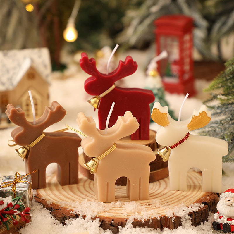 Cozy holiday scene with Elk aromatherapy candle and Christmas decorations