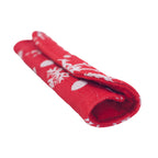 Christmas refrigerator handle covers in red and green creating a warm holiday kitchen ambiance