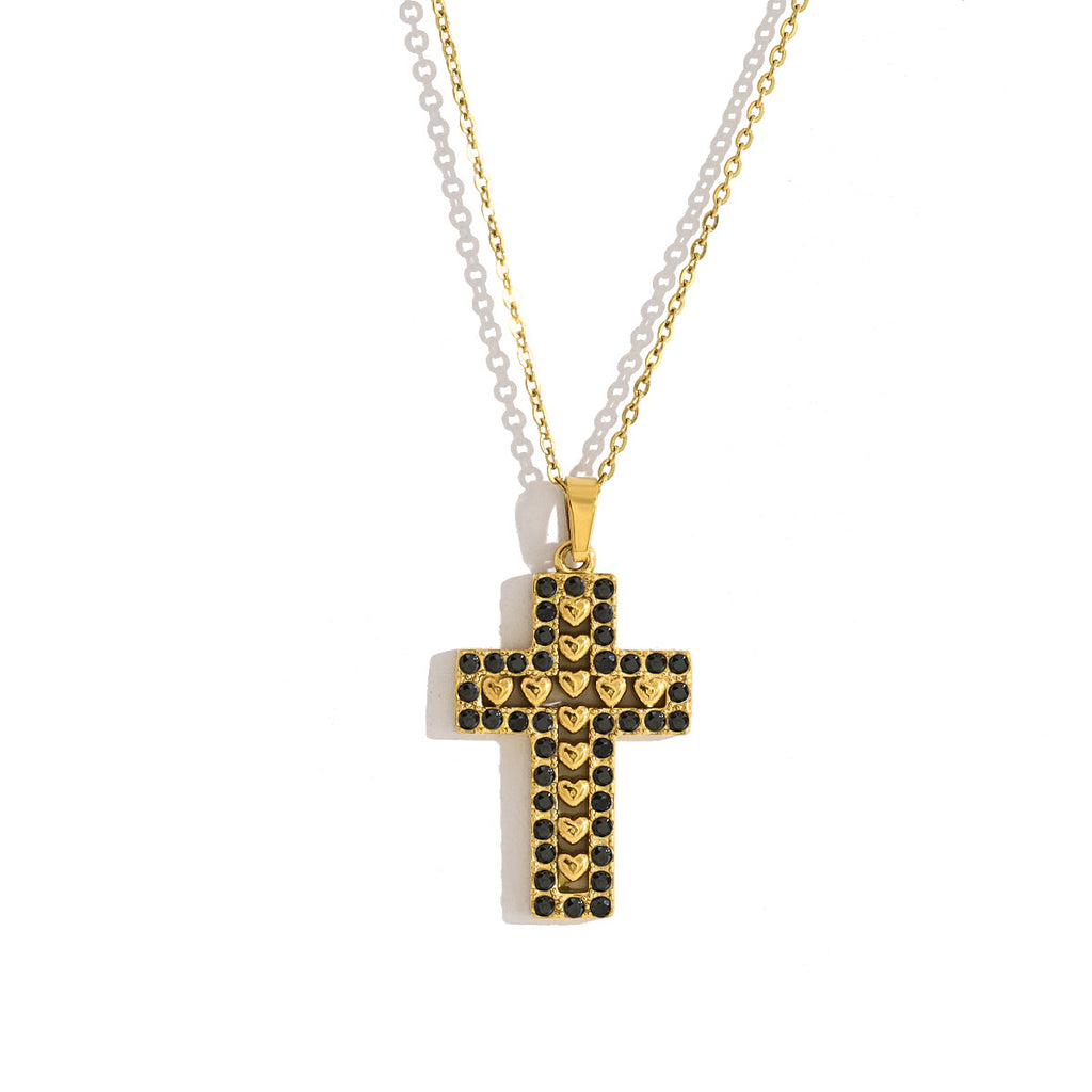 Gold-tone stainless steel cross pendant necklace with chain on light background