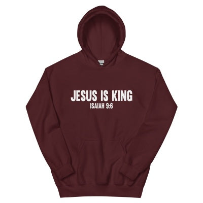 Teen in Jesus Is King hoodie smiling outdoors