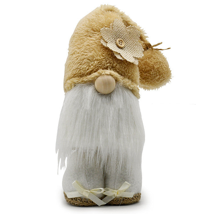 Close-up of handmade faceless doll ornament detail