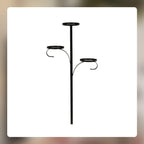 Christmas tree with elegant wrought iron candlestick tree topper glowing warmly