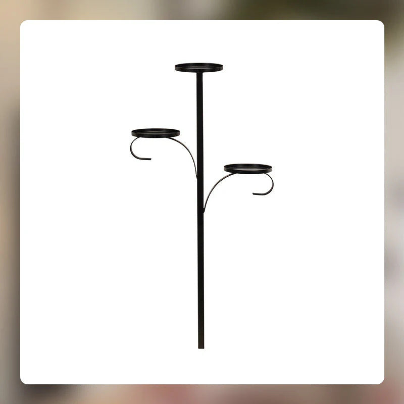 Christmas tree with elegant wrought iron candlestick tree topper glowing warmly