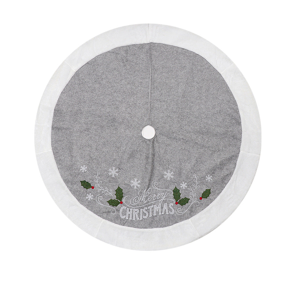 Soft flannel and non-woven gray tree skirt with decorative leaf motif