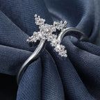 Close-up view of diamond-set cross motif on copper ring band