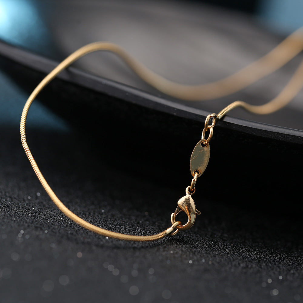 Gold-plated cross necklace pendant detail Main image
