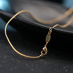 Gold-plated cross necklace pendant detail
