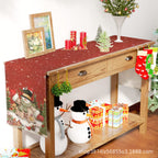 Christmas snowman table runner laid out on dining table for holiday gatherings