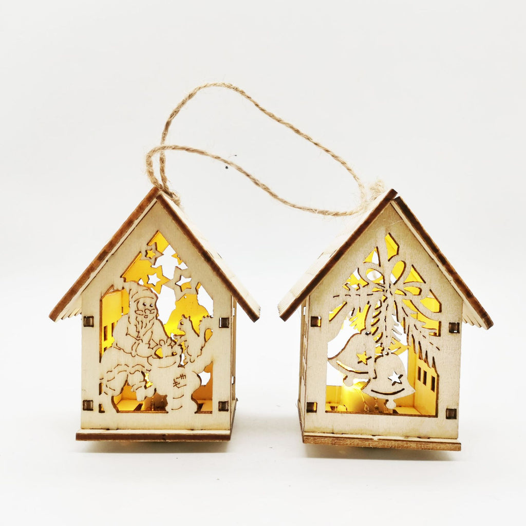 Boxwood craftwork Christmas small house ornaments arranged on rustic surface