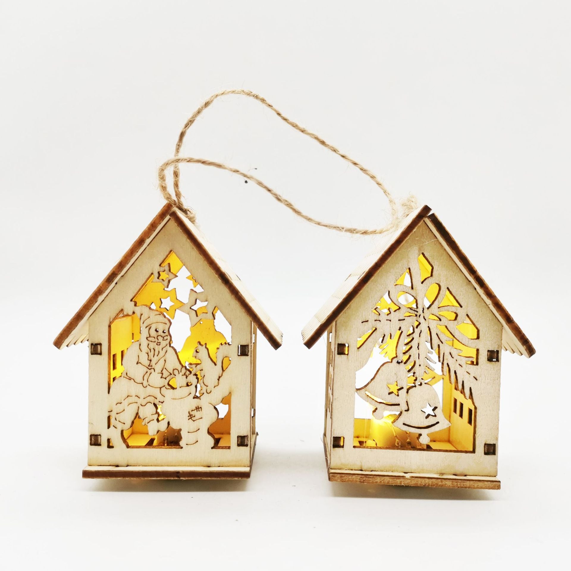 Boxwood craftwork Christmas small house ornaments arranged on rustic surface