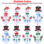Colorful felt snowman decoration with multiple accessories arranged on craft table