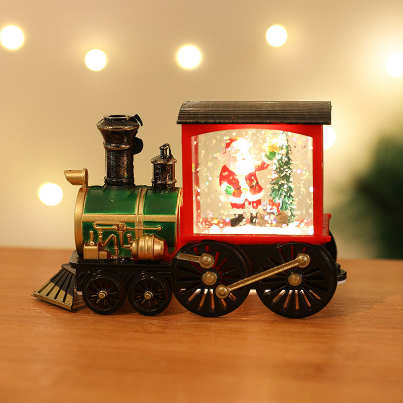 Christmas decoration featuring gold train and Santa Claus motif