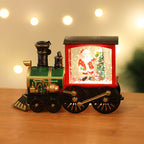 Christmas decoration featuring gold train and Santa Claus motif