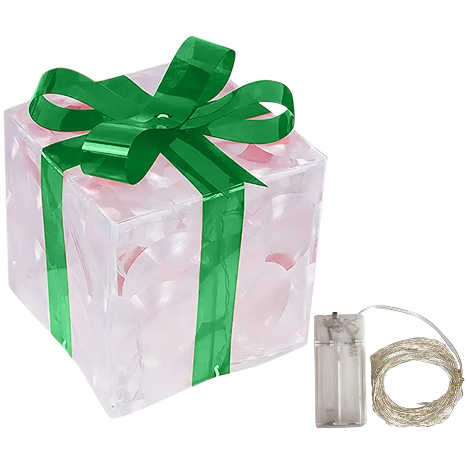 Glowing Christmas gift box ornament with warm LED lights on decorative surface