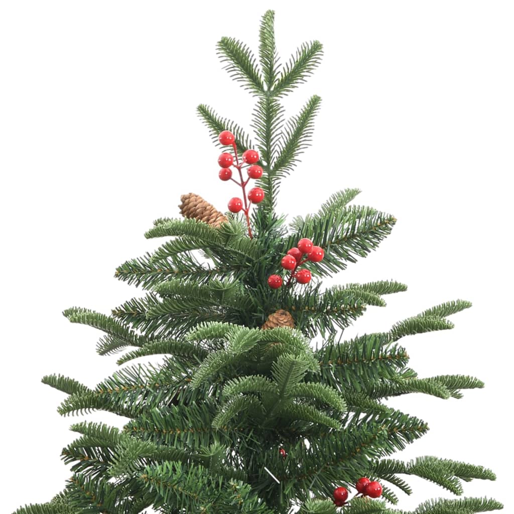Fully decorated green artificial Christmas tree in a cozy indoor setting with festive ambiance