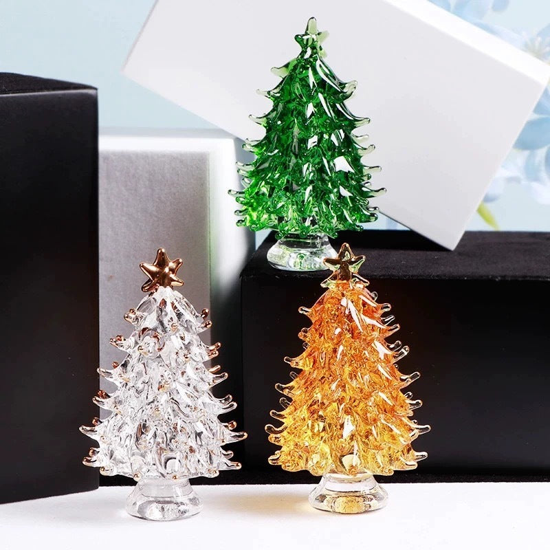Multiple crystal Christmas tree ornaments in various colors grouped together