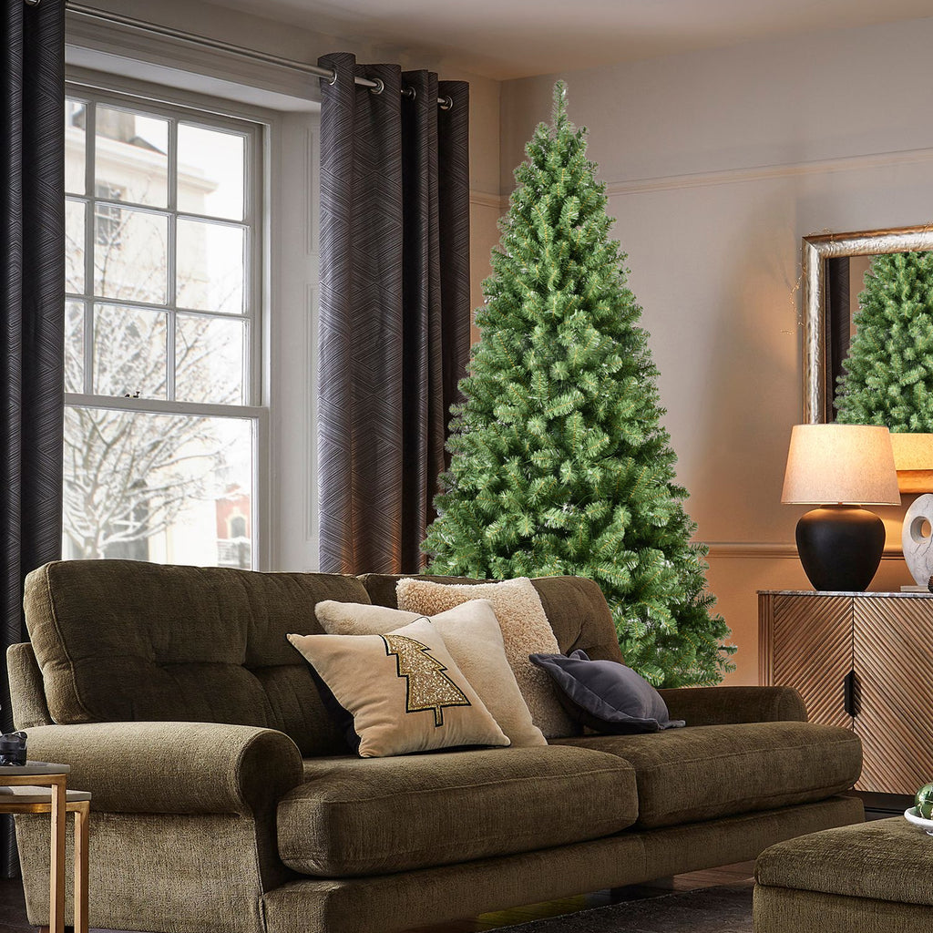 Prelit green tree branches with soft glowing lights