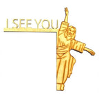 Jesus and angel sculpture displayed on wooden door frame in home setting