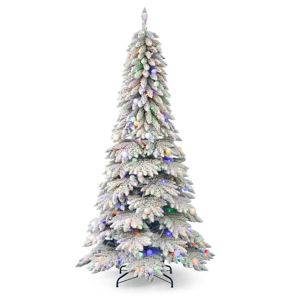 Pre-lit LED Christmas tree in full decoration with ornaments in festive home setting
