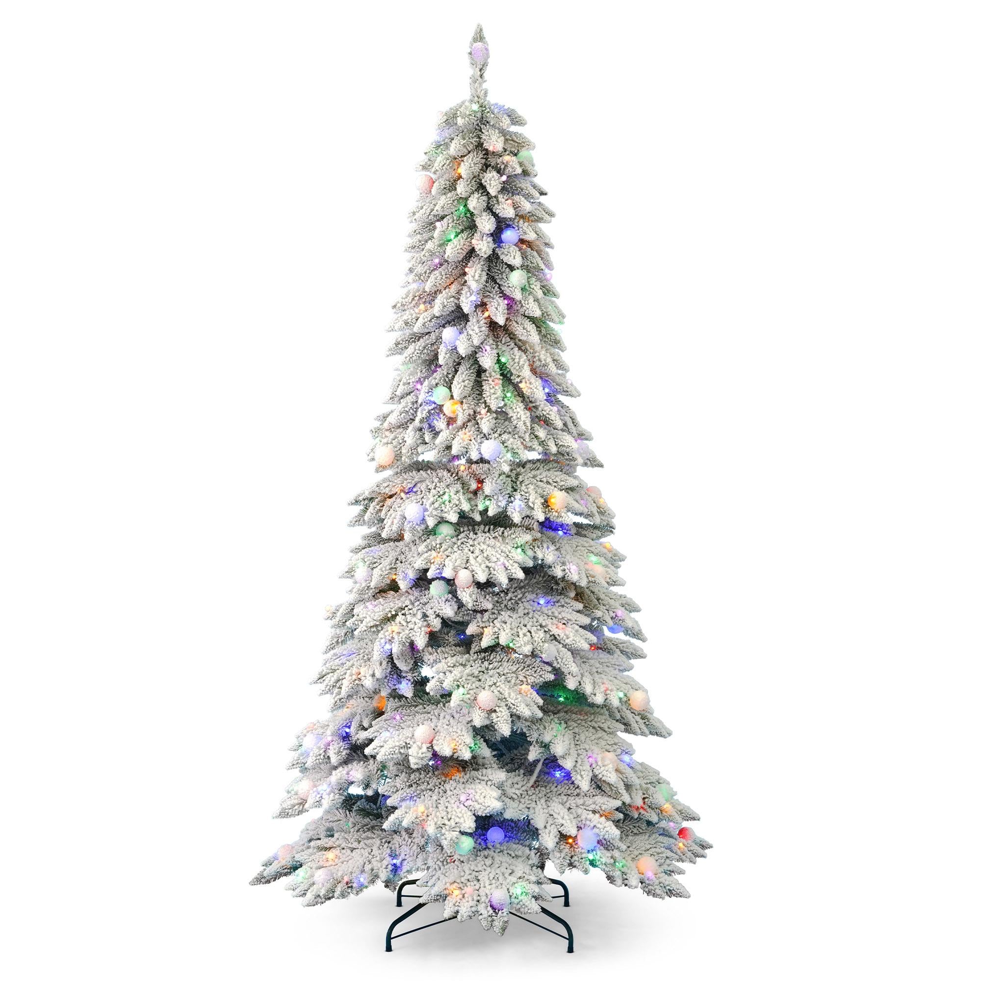 Pre-lit LED Christmas tree in full decoration with ornaments in festive home setting