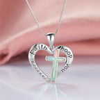 Heart-shaped cross pendant with imitation opal displayed on white background
