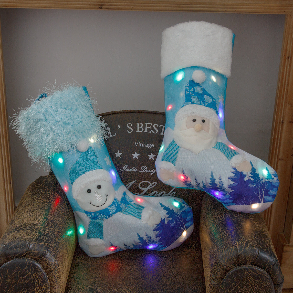 Snowman design plush Christmas stocking with warm glow effect for festive display