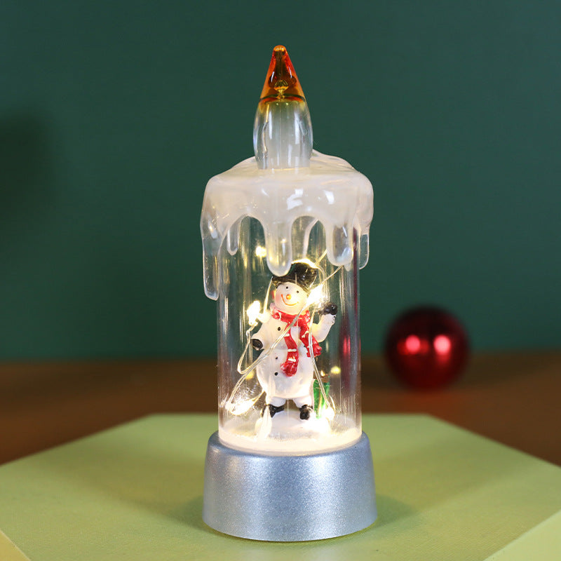 Detailed view of festive Christmas desktop ornament featuring warm candle light and holiday charm