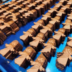 Set of wooden villain ornaments laid out for religious crafting projects