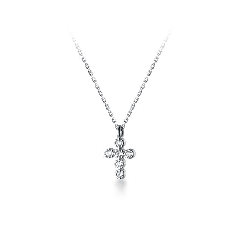 Close-up of sterling silver cross pendant
