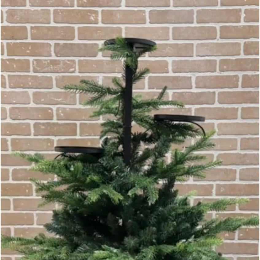Handcrafted iron candlestick detail showing traditional Christmas design aesthetic