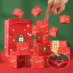 Christmas Eve surprise box set in cinnabar red and olive green with bounce boxes laid out on festive table