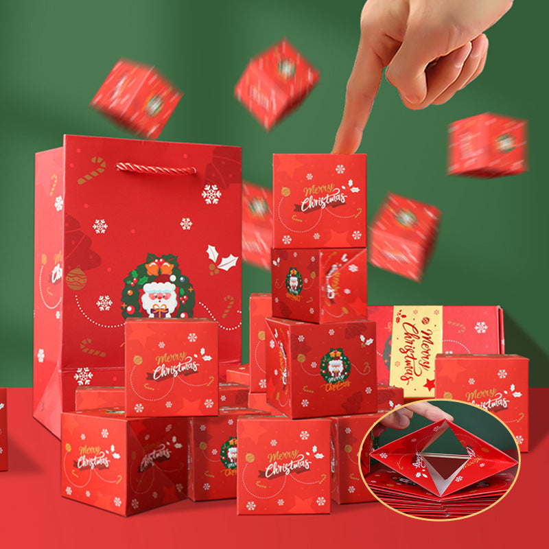 Christmas Eve surprise box set in cinnabar red and olive green with bounce boxes laid out on festive table