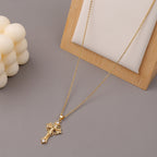 Geometric exaggerated cross necklace on model
