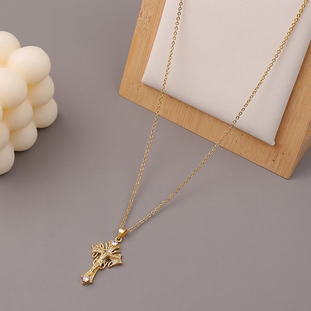 Geometric exaggerated cross necklace on model