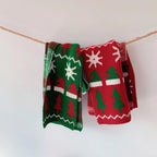 Cozy children's Christmas scarf featuring holiday motifs for winter warmth