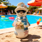 Beach snowman ornament displayed in cozy holiday setting with warm lighting
