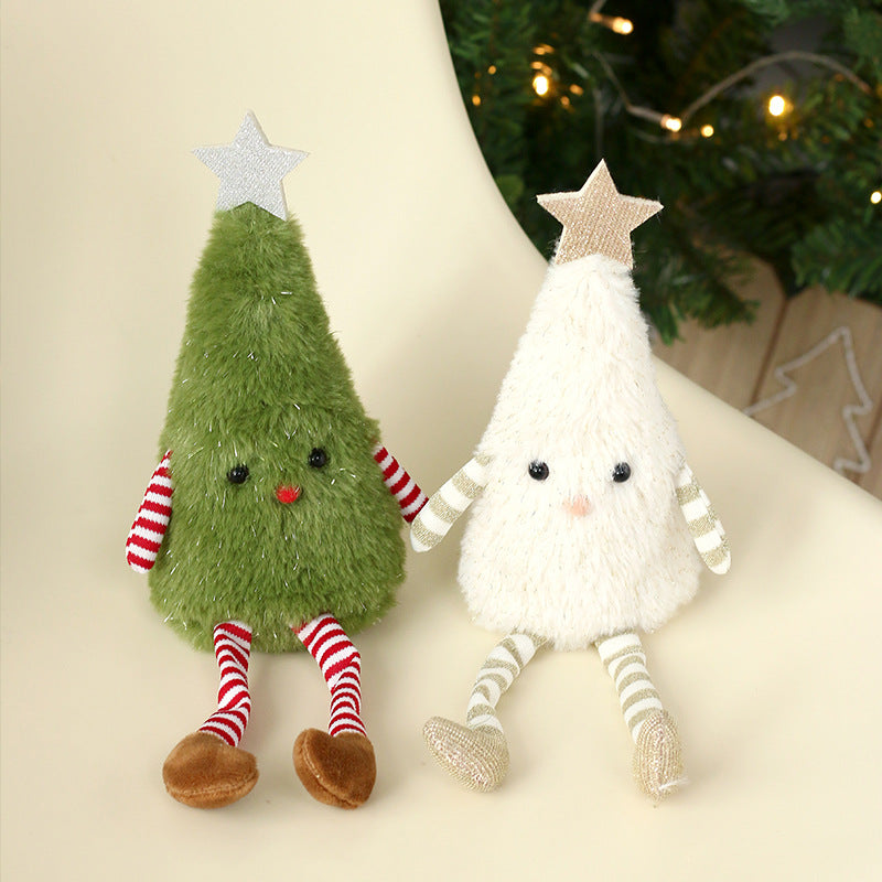 Festive plush doll Christmas ornament in green and white fabric hanging from a tree branch