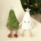 Festive plush doll Christmas ornament in green and white fabric hanging from a tree branch