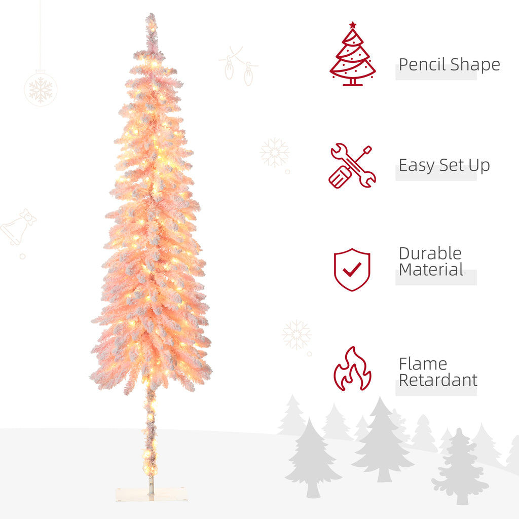 Close-up of pink flocked branches with artificial snow and warm white LED lights