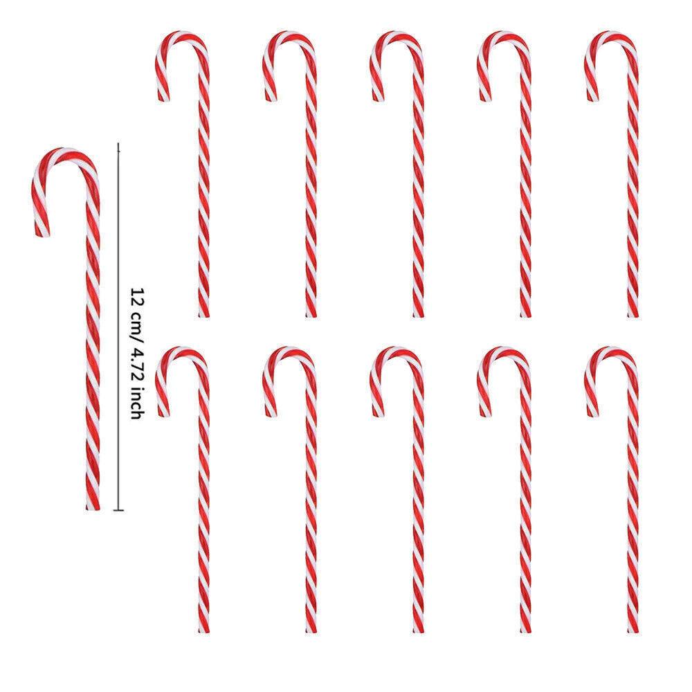 Small acrylic Christmas pendant with crutch candy design hanging from branch